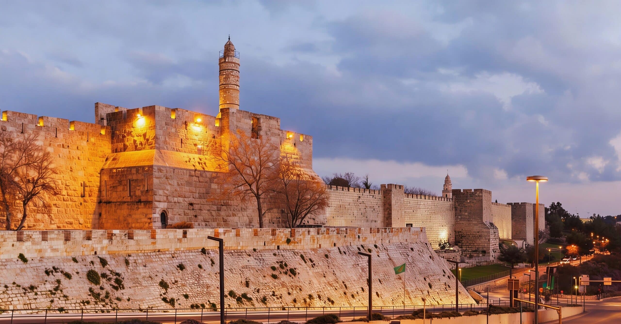 The Old City walls and the Tower of David in Jerusalem at sunset